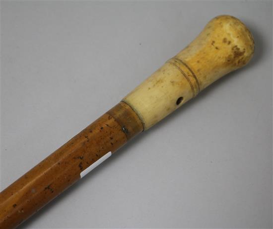An early 18th century ivory and malacca walking cane